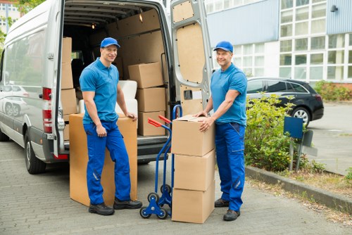 Customer loading household items into a nearby storage unit