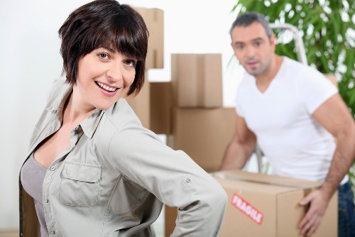 Professional movers handling furniture during a Crewshill home move
